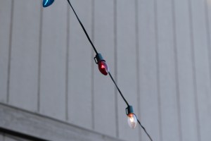 Kevin strung red, white, & blue lights over the patio and along the fence.