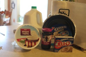 Hot fudge dessert topping, 1 Oreo pie crust, 1 8oz, tub of Cool Whip, cold milk, and 2 pkg. (4 serving size each) Jello Oreo flavor instant pudding & pie filling