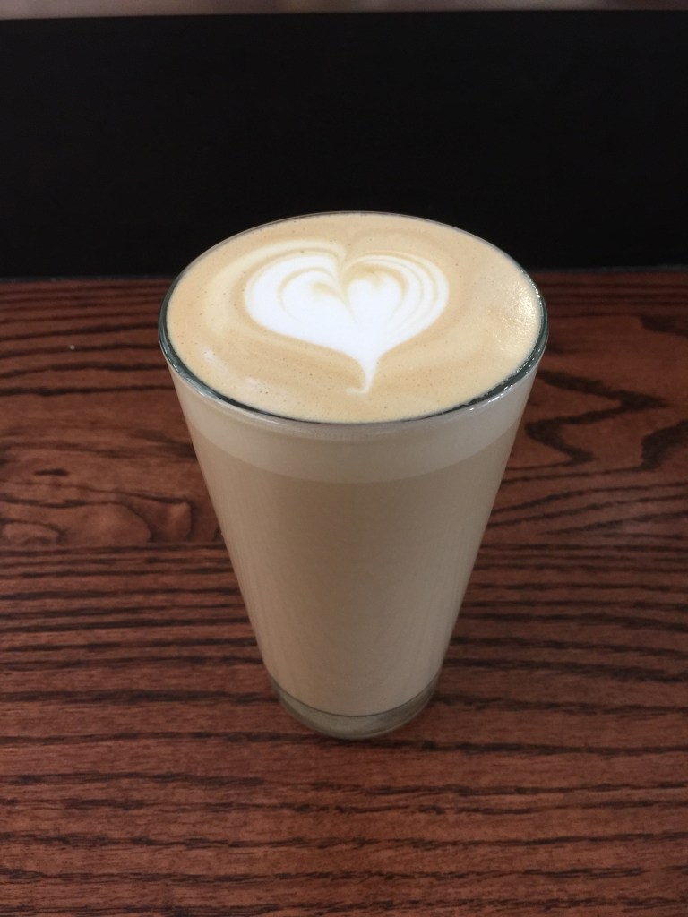 Ok, I was surprised that my coffee was served in a drinking glass, however, that did not influence my opinion of the coffee. It was delicious and I always love it when the barista can make a design with the foam!