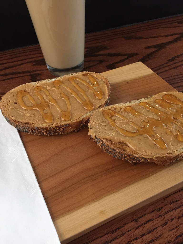 The menu was rather short, which took us by surprise. I ordered toast with peanut butter & honey. What was really neat though is that it was artisan bread with the fresh ground peanut butter, and the toast was served on wooden cutting boards.